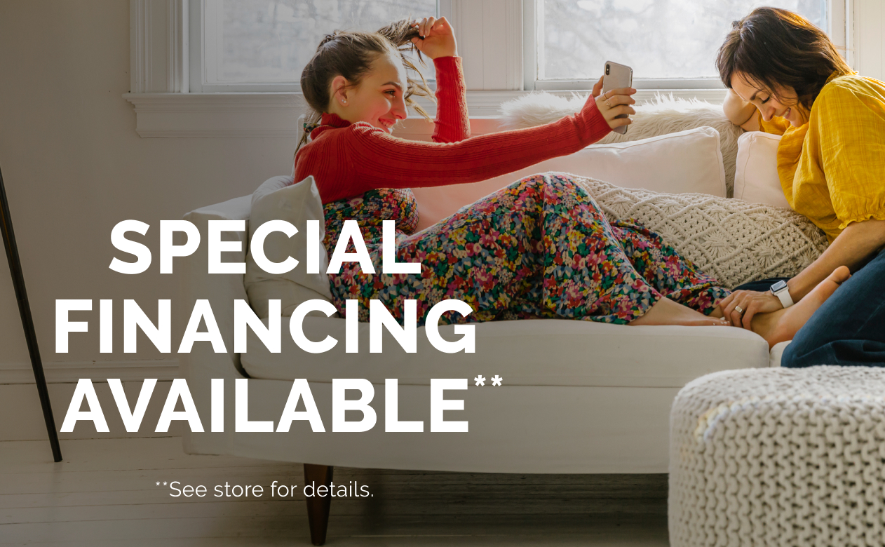 Special Financing Available, two girls sitting on sofa.